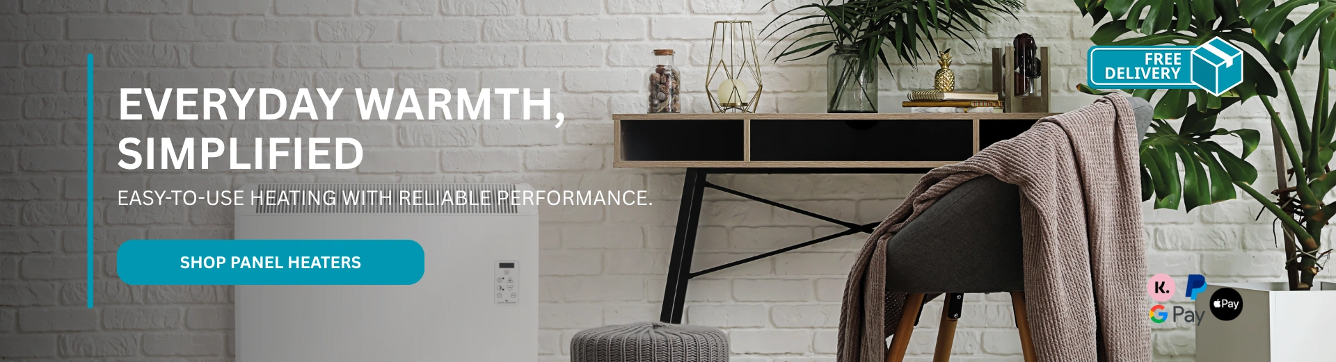 A panel heater installed on a brick wall next to a desk, with the text "Everyday warmth, simplified."